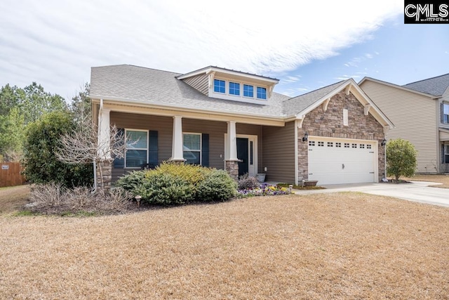craftsman house with driveway, a porch, a shingled roof, a garage, and stone siding