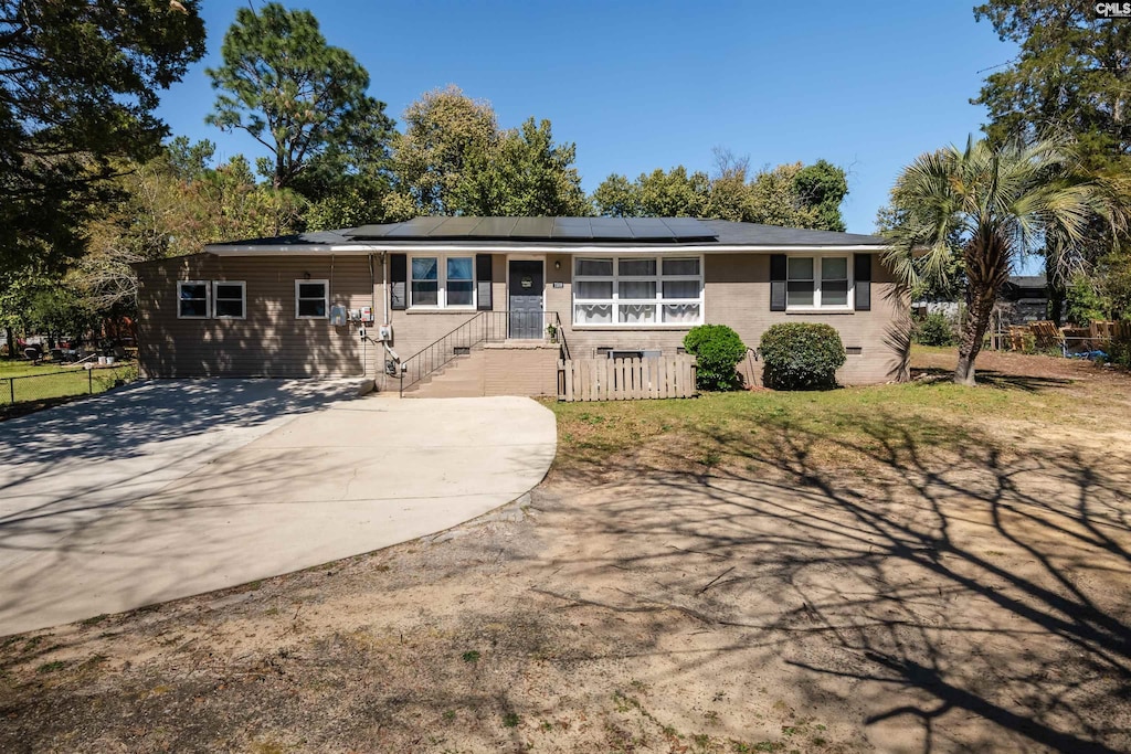 7509 Claudia Dr, Columbia, SC 29223 - single story home with solar panels and a front lawn