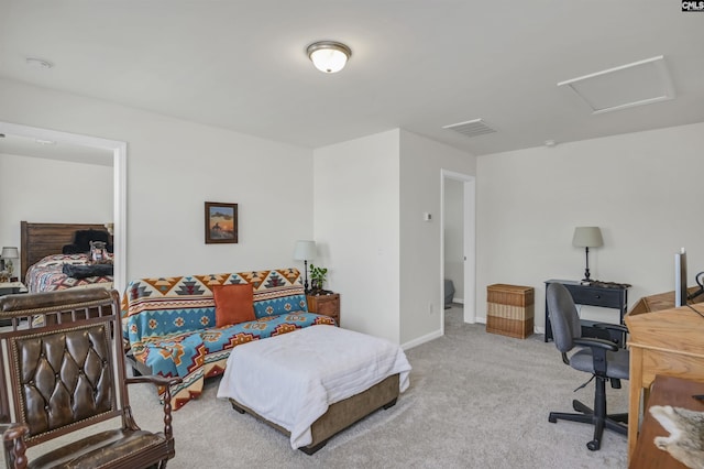 carpeted home office featuring visible vents, baseboards, and attic access