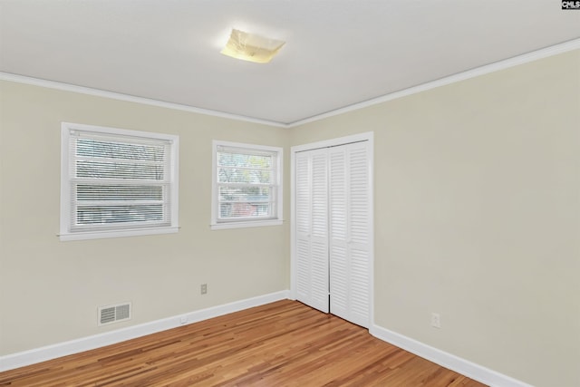 1632 Romain Dr, Columbia, SC 29210 - unfurnished bedroom with visible vents, light wood-style floors, baseboards, and ornamental molding