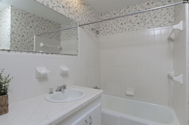 1632 Romain Dr, Columbia, SC 29210 - bathroom with wallpapered walls, bathing tub / shower combination, vanity, and tile walls