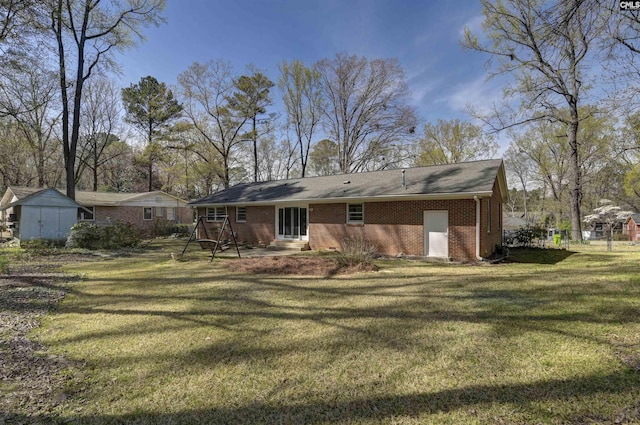 1632 Romain Dr, Columbia, SC 29210 - rear view of house featuring a patio, a lawn, and brick siding
