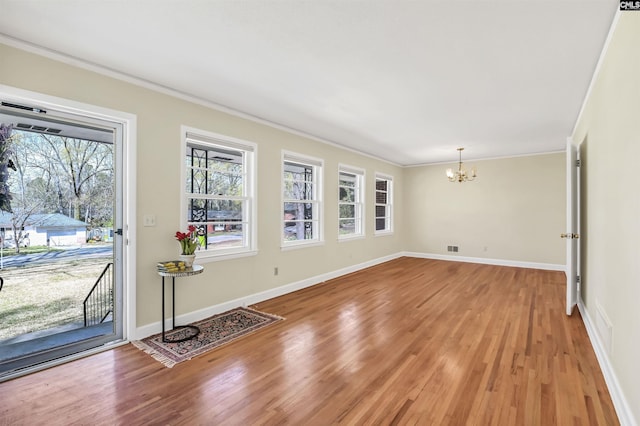 1632 Romain Dr, Columbia, SC 29210 - interior space with a chandelier, light wood-type flooring, baseboards, and ornamental molding