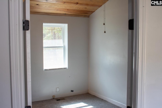 212/210 Nash Rd, Bishopville, SC 29010 - carpeted empty room featuring visible vents, baseboards, and wood ceiling