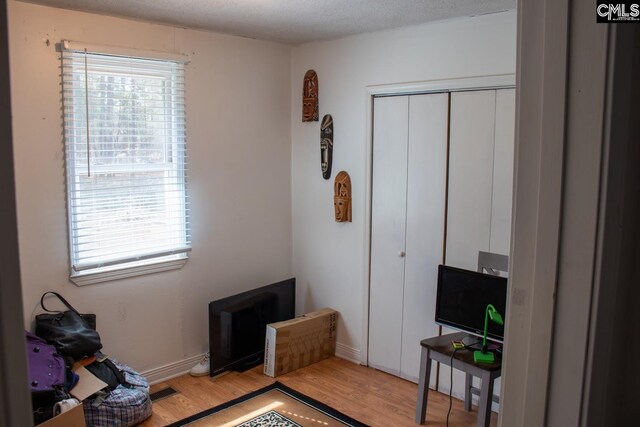 212/210 Nash Rd, Bishopville, SC 29010 - bedroom with light wood-style floors, a closet, and baseboards