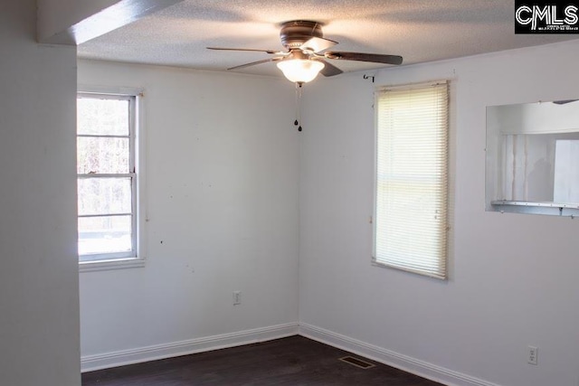 212/210 Nash Rd, Bishopville, SC 29010 - spare room featuring baseboards, visible vents, a textured ceiling, and ceiling fan