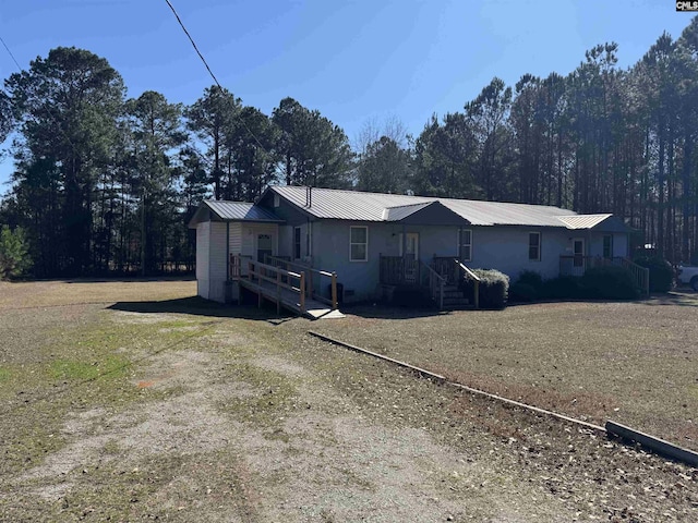 212/210 Nash Rd, Bishopville, SC 29010 - view of property exterior with metal roof