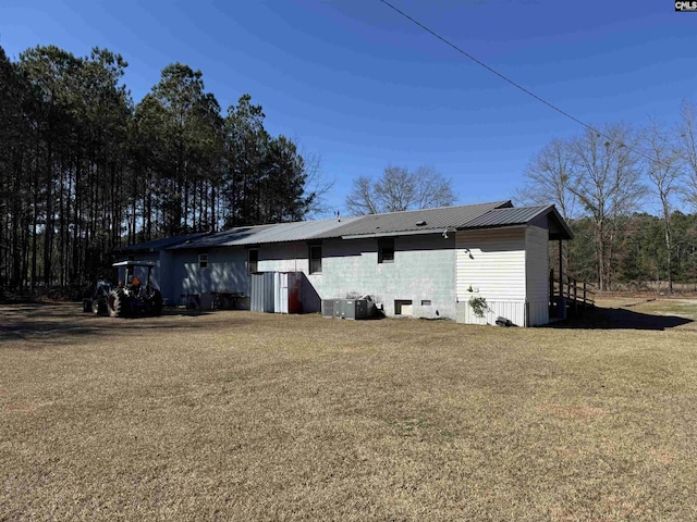212/210 Nash Rd, Bishopville, SC 29010 - back of house with metal roof and a lawn