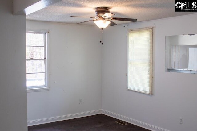 212/210 Nash Rd, Bishopville, SC 29010 - spare room featuring visible vents, baseboards, a textured ceiling, and a ceiling fan