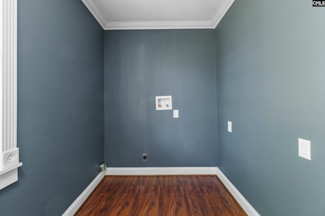 spare room featuring baseboards, dark wood-style floors, and crown molding