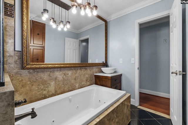 bathroom with a whirlpool tub, crown molding, tile patterned flooring, and baseboards