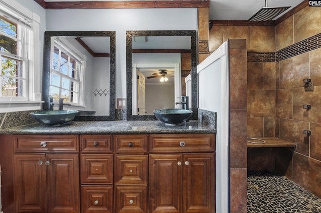 full bath featuring a ceiling fan, double vanity, a sink, and a walk in shower