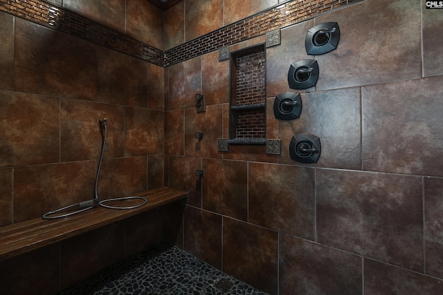 full bathroom with tiled shower