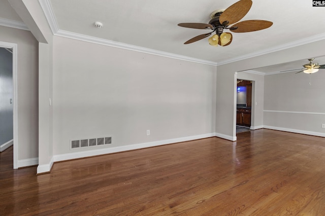 empty room featuring wood finished floors, visible vents, baseboards, and ceiling fan