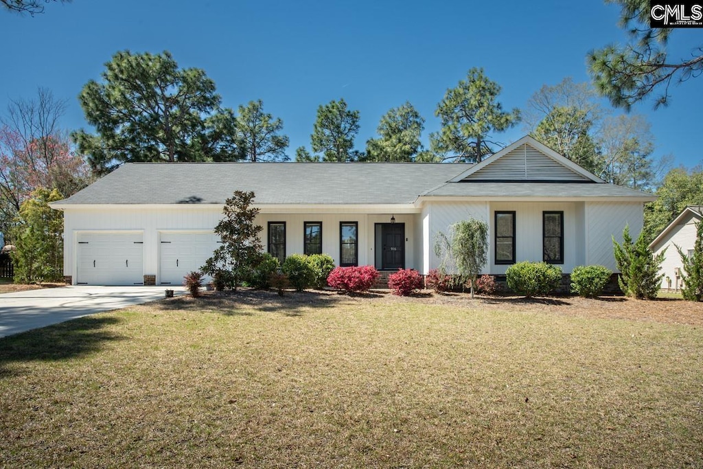 916 Wotan Rd, Columbia, SC 29229 - view of front of home featuring a front yard, concrete driveway, and an attached garage