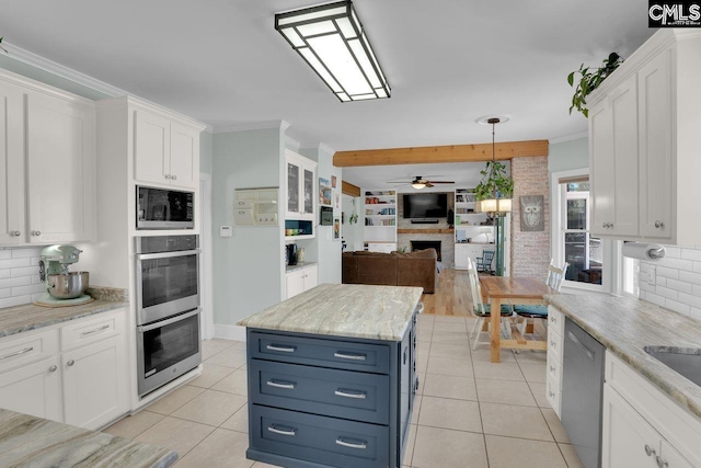 538 Wateroak Trl, Chapin, SC 29036 - kitchen with ceiling fan, ornamental molding, stainless steel appliances, white cabinetry, and open floor plan