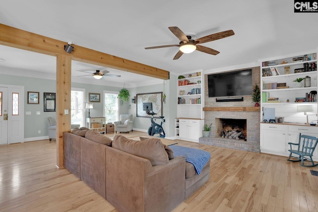 538 Wateroak Trl, Chapin, SC 29036 - living room featuring a fireplace, light wood-style flooring, built in features, baseboards, and ceiling fan