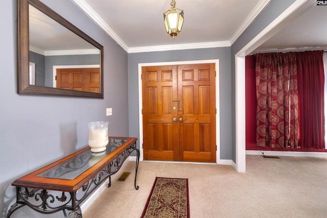 entrance foyer featuring carpet flooring, crown molding, and baseboards