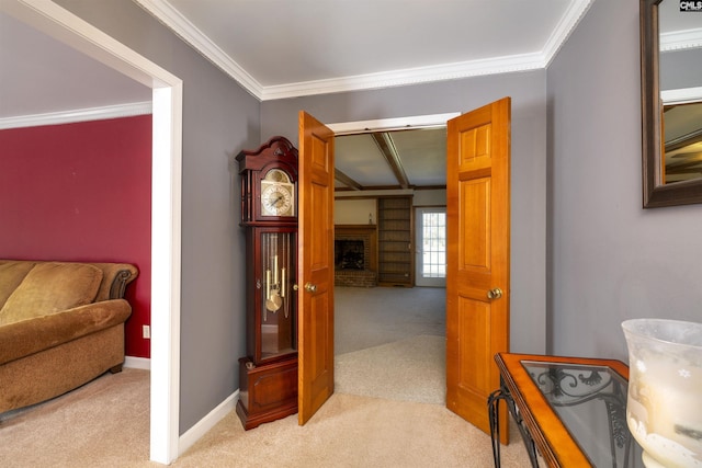 corridor with baseboards, crown molding, and light colored carpet