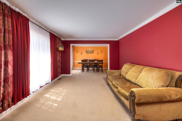 living room featuring light carpet, crown molding, baseboards, and a chandelier