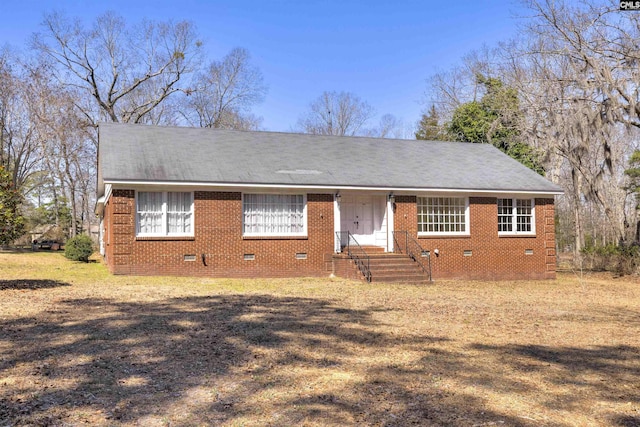ranch-style house featuring brick siding, crawl space, and roof with shingles