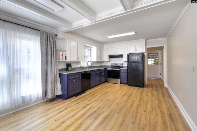 kitchen with white cabinets, crown molding, under cabinet range hood, a sink, and black appliances