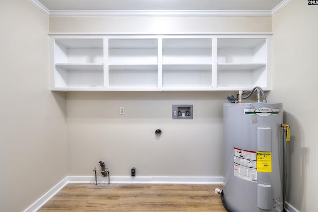 laundry room featuring water heater, electric dryer hookup, laundry area, ornamental molding, and hookup for a washing machine