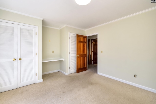 unfurnished bedroom with baseboards, ornamental molding, and light carpet