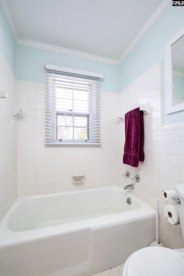 bathroom featuring tile walls, ornamental molding, toilet, and a bath