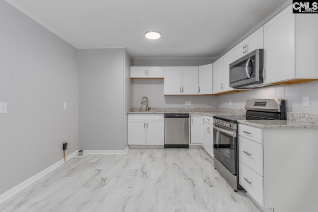 4104 Candlelite Dr, Columbia, SC 29209 - kitchen with white cabinetry, crown molding, a sink, light stone counters, and appliances with stainless steel finishes