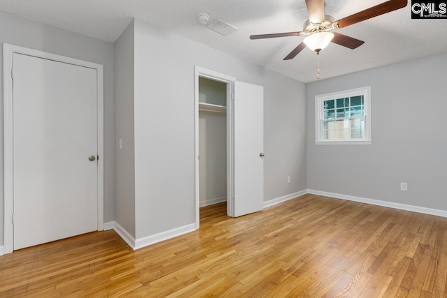 4104 Candlelite Dr, Columbia, SC 29209 - unfurnished bedroom featuring baseboards, a closet, light wood-style flooring, and a textured ceiling