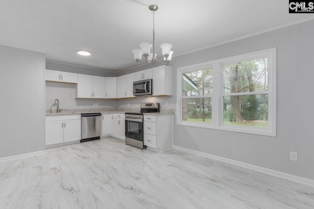4104 Candlelite Dr, Columbia, SC 29209 - kitchen featuring a notable chandelier, crown molding, white cabinets, and stainless steel appliances