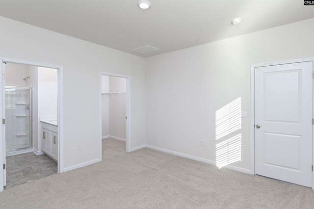 130 Shumard Ct, Columbia, SC 29203 - unfurnished bedroom featuring light carpet, a closet, ensuite bathroom, and a walk in closet