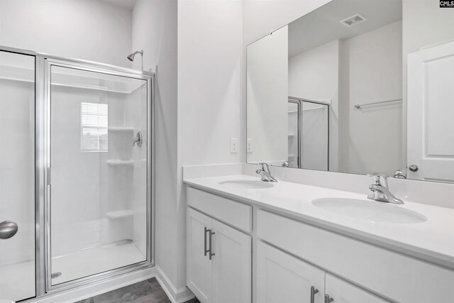 130 Shumard Ct, Columbia, SC 29203 - full bath featuring visible vents, a sink, a stall shower, and double vanity