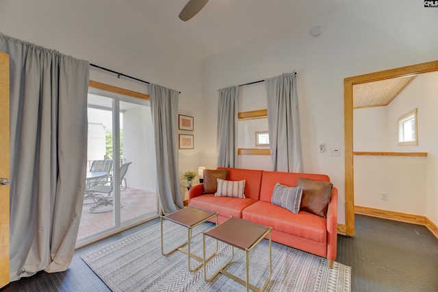 living area featuring carpet flooring, a healthy amount of sunlight, and ceiling fan
