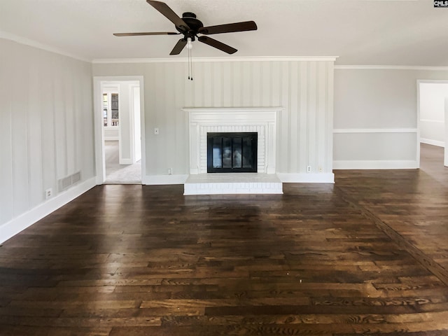 unfurnished living room featuring visible vents, crown molding, dark wood-style flooring, and a ceiling fan