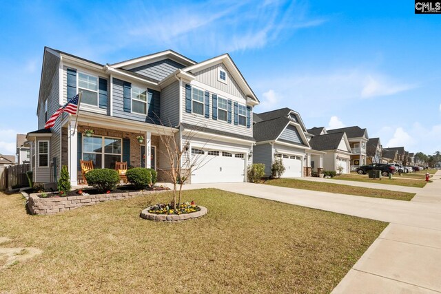 craftsman-style home with an attached garage, a front yard, board and batten siding, driveway, and a porch
