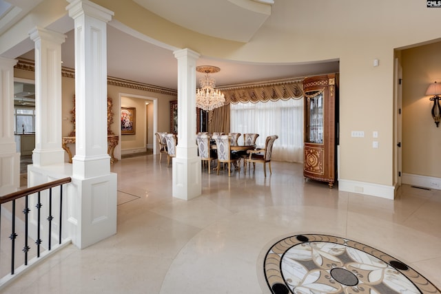 dining area featuring ornate columns, baseboards, an inviting chandelier, and crown molding