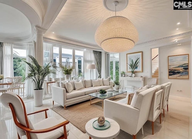 living room featuring ornate columns, a wealth of natural light, stairway, and crown molding