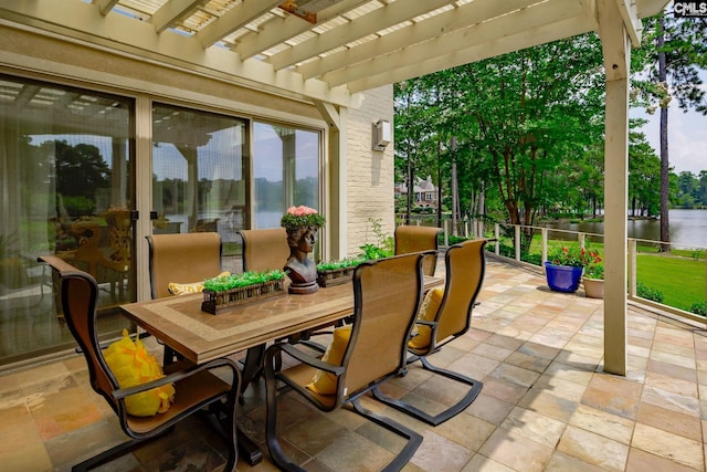 view of patio featuring outdoor dining space and a pergola