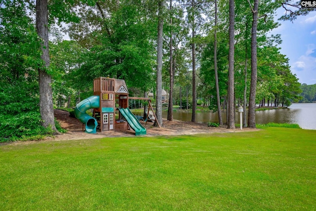 community jungle gym with a water view and a yard