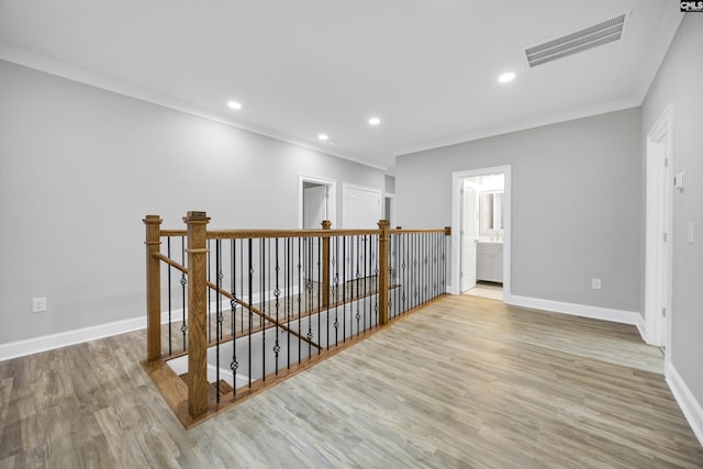 193 Peppermint Ln, Blythewood, SC 29016 - interior space with an upstairs landing, visible vents, baseboards, ornamental molding, and wood finished floors