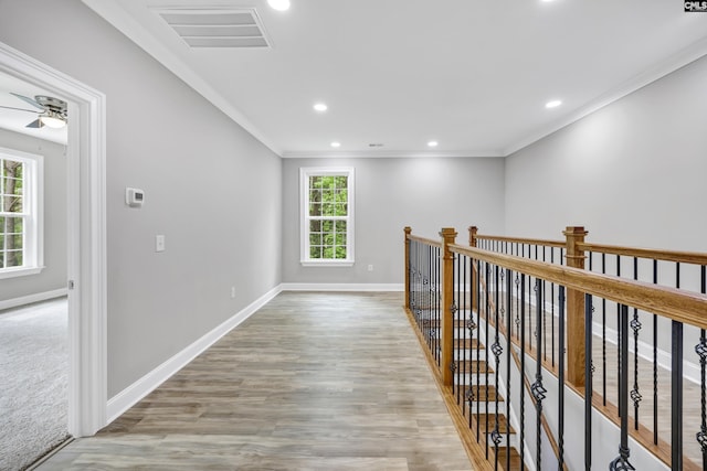 193 Peppermint Ln, Blythewood, SC 29016 - hallway featuring recessed lighting, wood finished floors, baseboards, visible vents, and crown molding