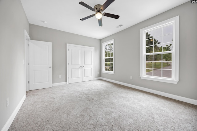 193 Peppermint Ln, Blythewood, SC 29016 - unfurnished bedroom featuring carpet floors, a closet, ceiling fan, baseboards, and visible vents