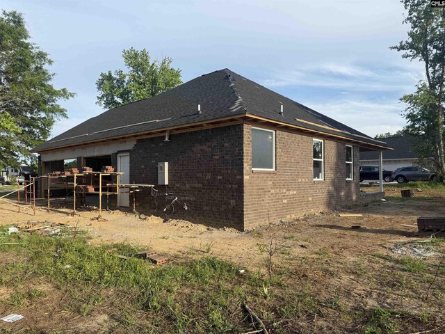 1270 Sandpiper Dr, Sumter, SC 29154 - view of home's exterior featuring brick siding and roof with shingles