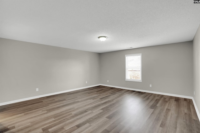 1827 Lake Carolina Dr, Columbia, SC 29229 - empty room with baseboards, a textured ceiling, and wood finished floors