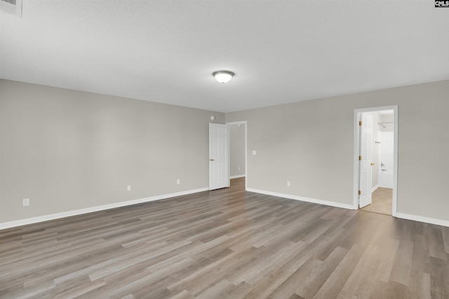 1827 Lake Carolina Dr, Columbia, SC 29229 - empty room with baseboards, visible vents, wood finished floors, and a textured ceiling