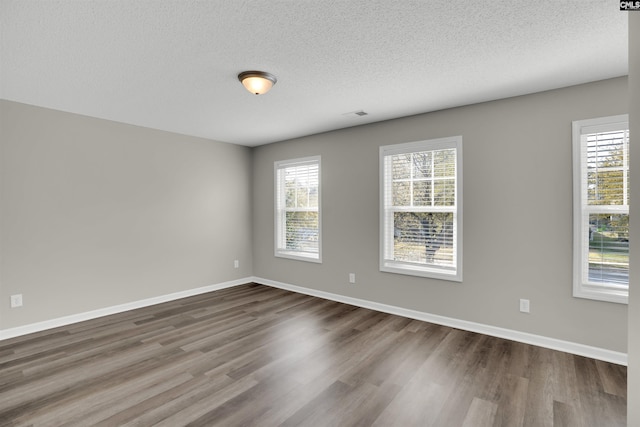 1827 Lake Carolina Dr, Columbia, SC 29229 - unfurnished room with dark wood-style floors, baseboards, and a healthy amount of sunlight