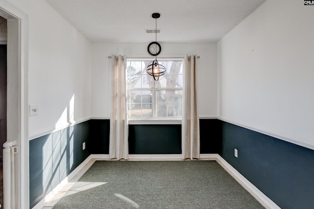 113 Silverstone Rd, Lexington, SC 29072 - unfurnished dining area with baseboards, carpet flooring, a textured ceiling, and visible vents