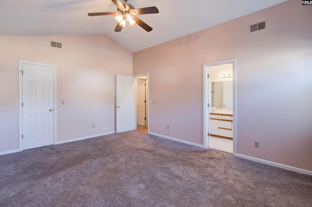 113 Silverstone Rd, Lexington, SC 29072 - unfurnished bedroom with baseboards, visible vents, carpet flooring, and vaulted ceiling